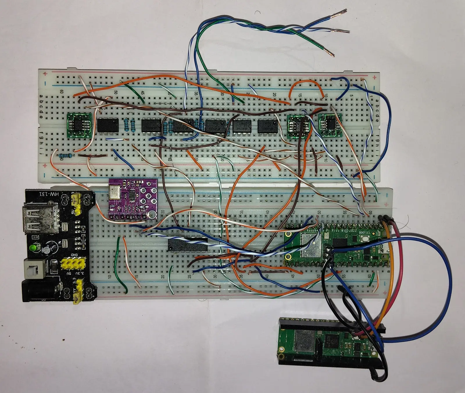 Potentiostat v4 — a Pico W talking to a row of op-amps, running the embassy-rs firmware that does CV, DPV, CA and EIS.